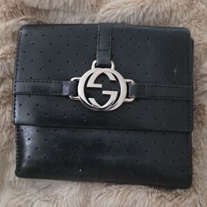 Authentic Gucci GG perforated leather wallet in classic black